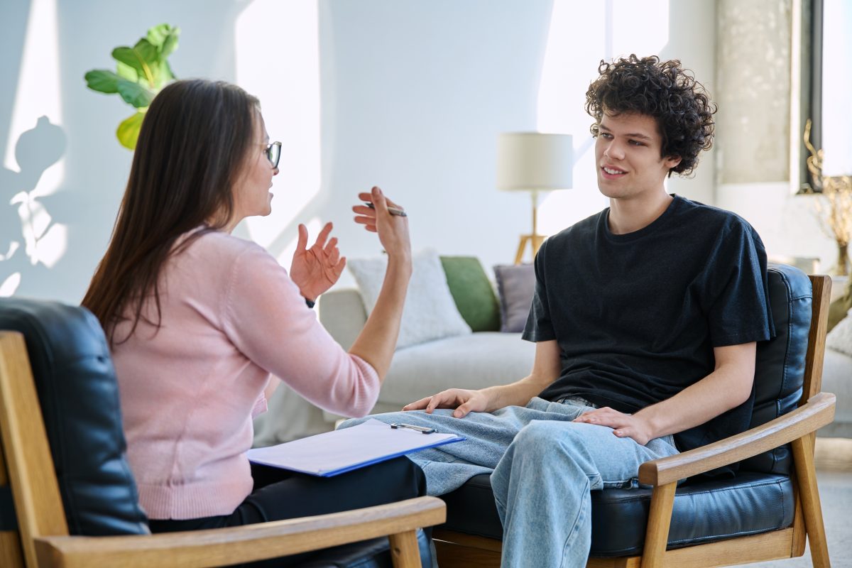 Young Male,Patient Talking To Professional Psychologist Social Worker Counselor